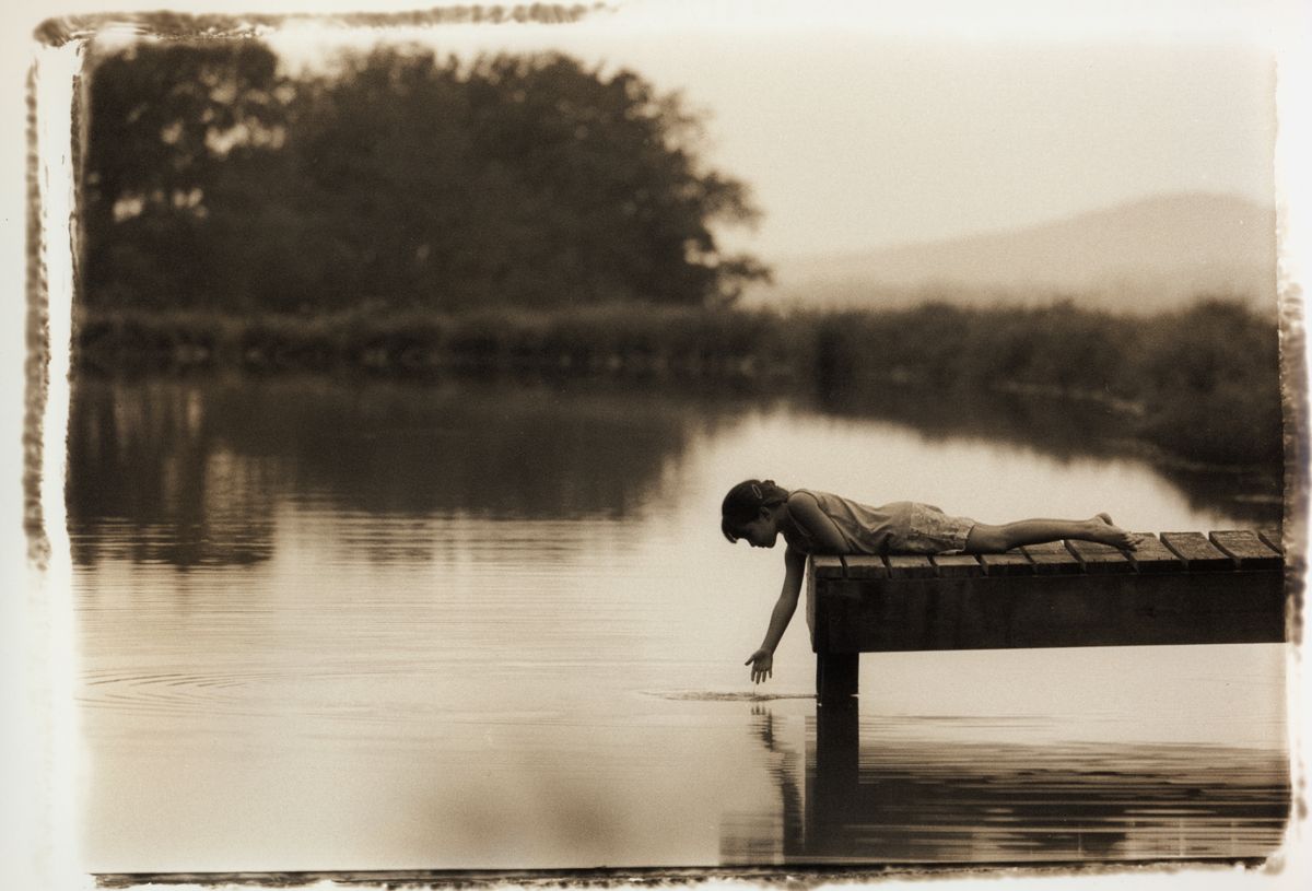 girl touching water.jpg