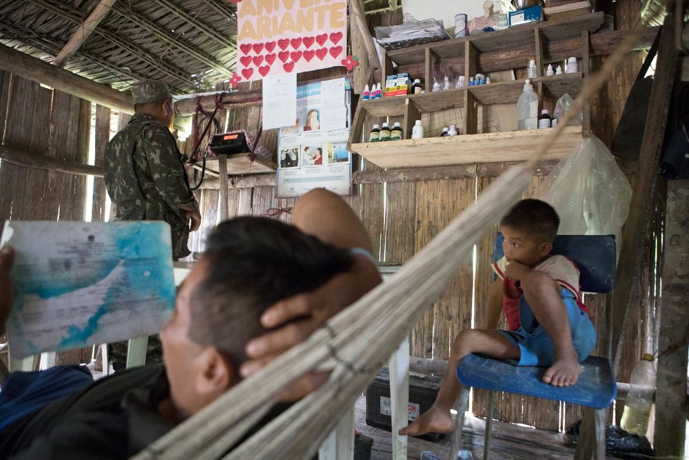 Frankie Genesio Marubo (aka Francine) talking on the radio in the Marubo Village of São Joaquim. Radio communication is the only method of communication that the indigenous people have along the Vale do Javari. Amazon
