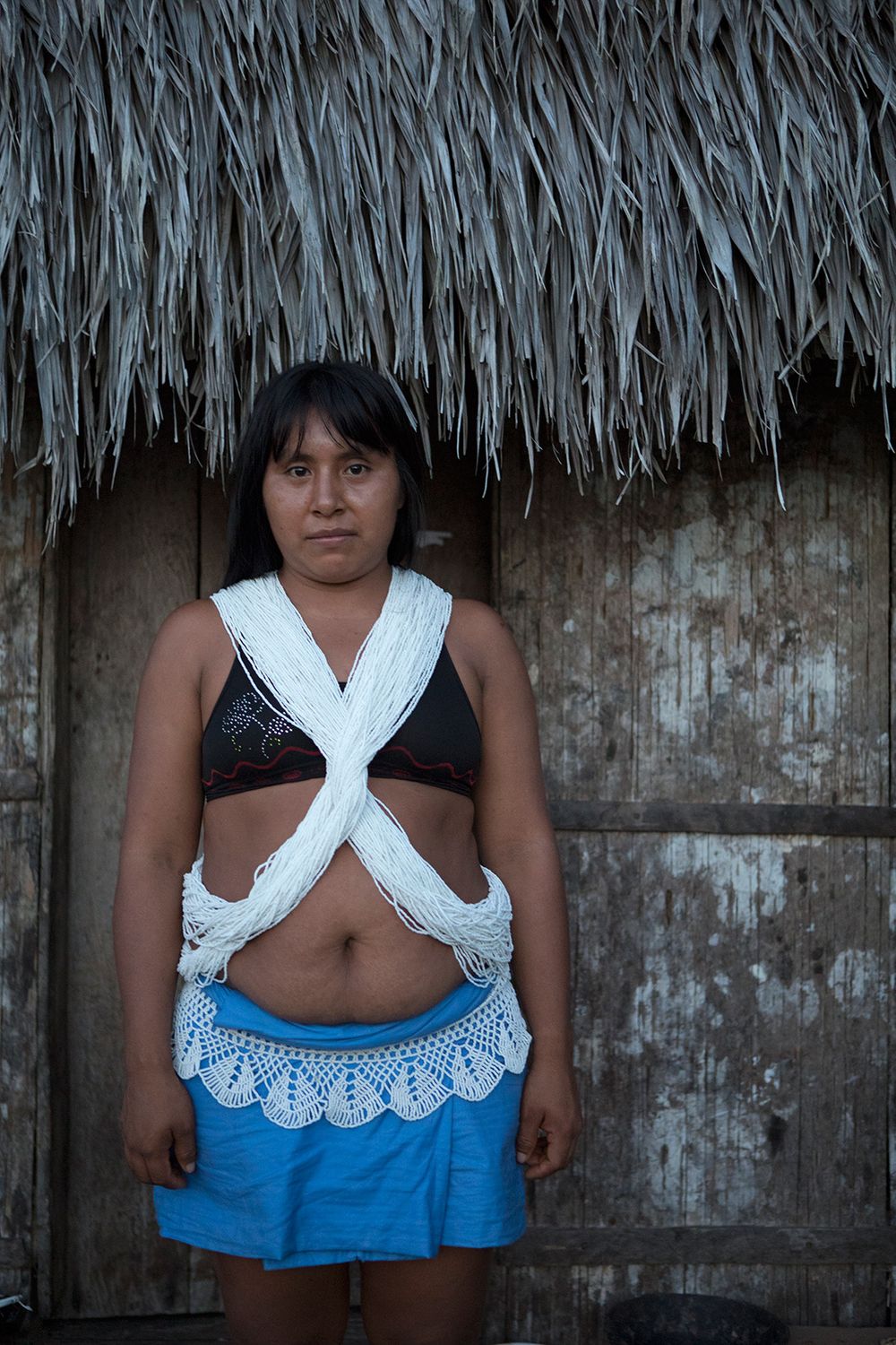 Mashe Marubo outside her Moloca in Rio Novo. Amazon