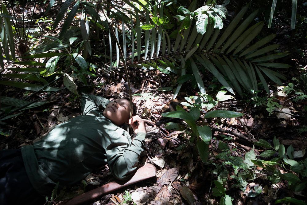 Young Korubo boy Seatvo (15) takes a rest during the first days trek through the Amazon. Amazon