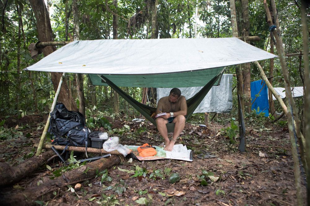FUNAI Official and expedition leader Bruno Pereira makes notes early morning before leading the expeditions on their first trek through the Vale do Javari. Amazon