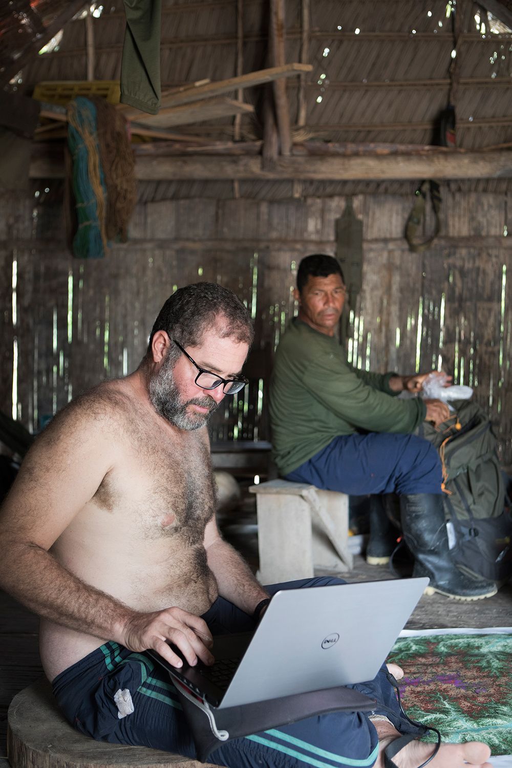 Bruno Pereira (38) plots the FUNAI expediton route with the assistance of Marcir Ferreira (49). The Marubo village of Rio Novo. Amazon