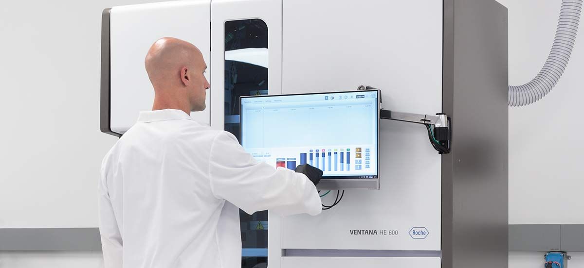Biotech Scientist Operating Clinical Laboratory Automation System