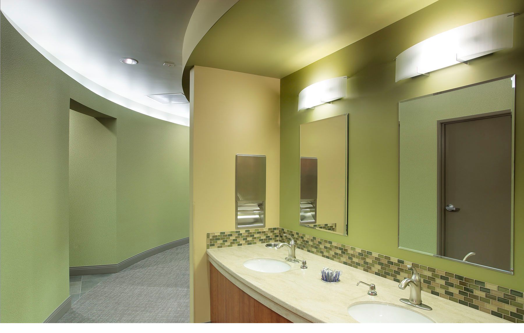 Modern dental office patient brushing station and curved hallway