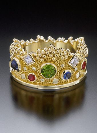 custom made in 18k yellow gold with granulation, tsavorite, sapphire, rubies, diamonds VS-F (total diamond weight 30 points), width varies up to 17mm. CROWN RING