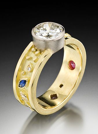 18k yellow gold, platinum with 1.5 ct diamond, sapphire, ruby, diamonds VS/F. 2-TONE SINGLE STONE RING