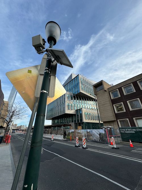 We mounted one camera to a street post to capture the main entrance's completion
