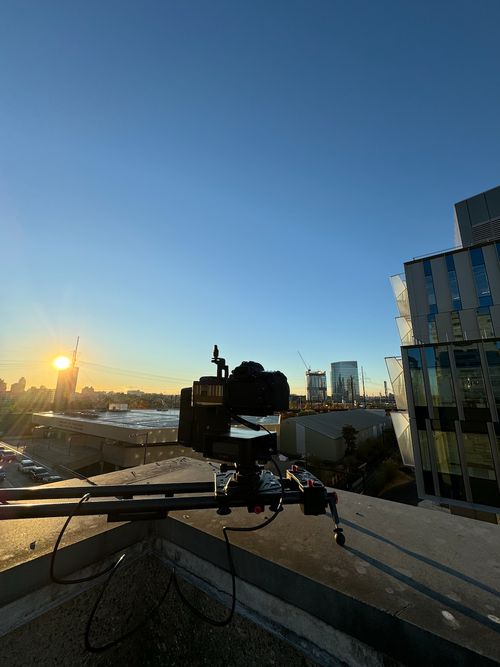 A sunrise motion-control dolly timelapse of the completed building.