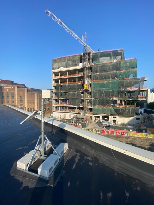 Performing routine quarterly maintenance on the camera looking West as the building takes shape