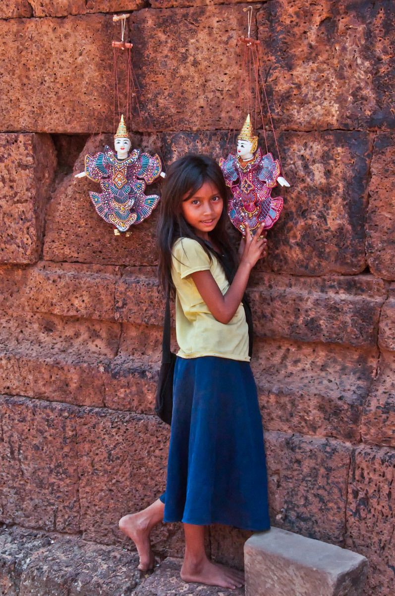 Girl selling Puppets, Angkor, Cambodia