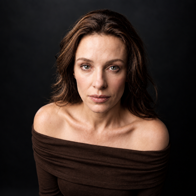 Contemplative Off-Shoulder Studio Portrait.png