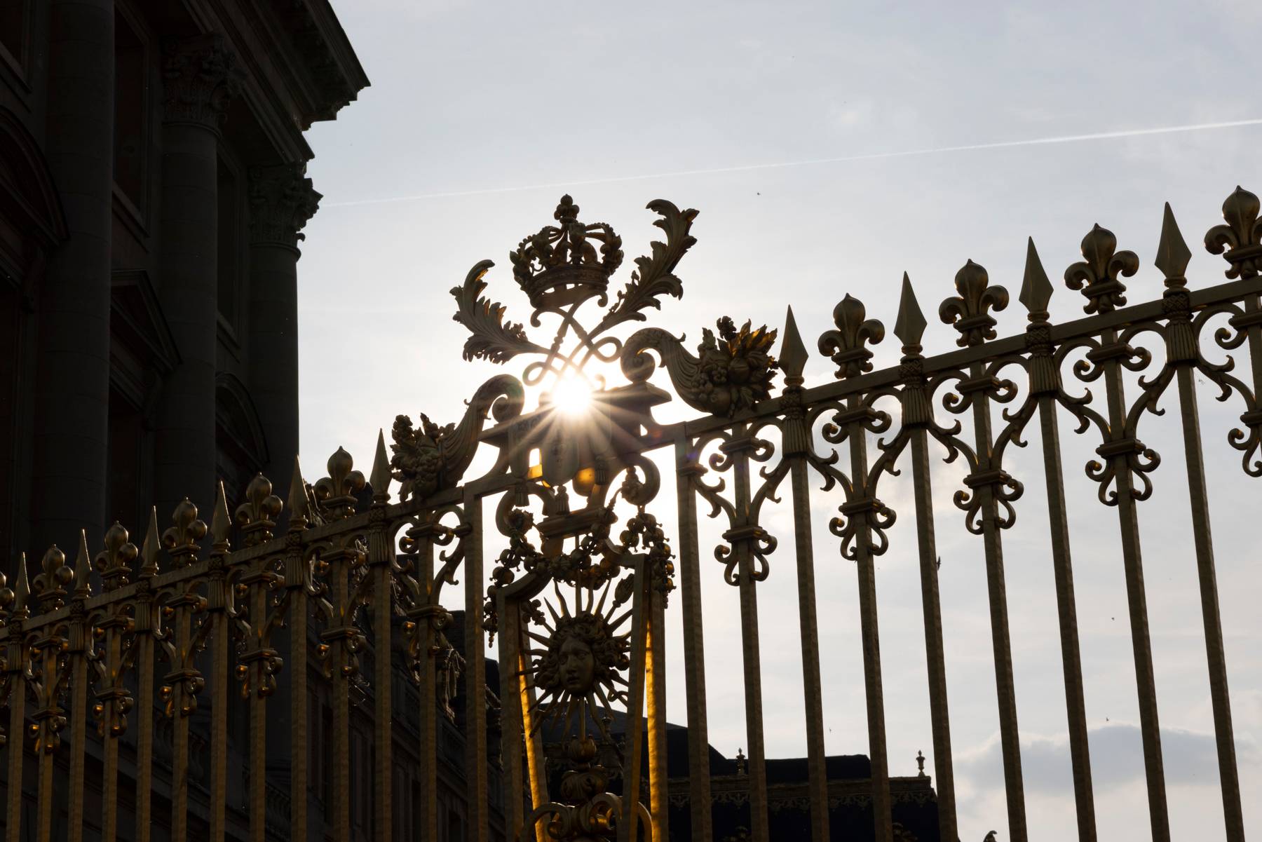 Sun setting over fence motif