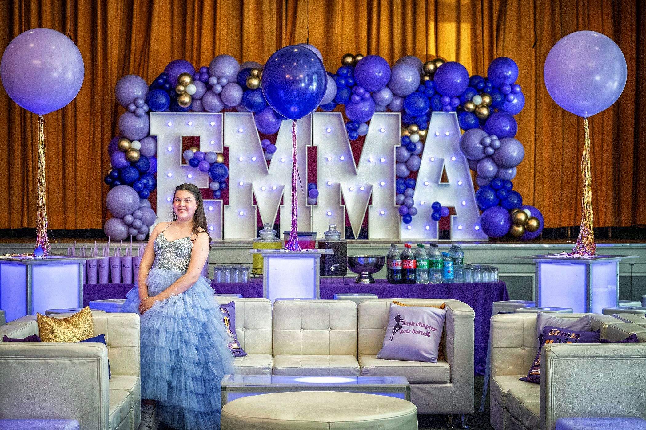 Bat Mitzvah Girl  With Her Logo, Party Balloons, and Decor