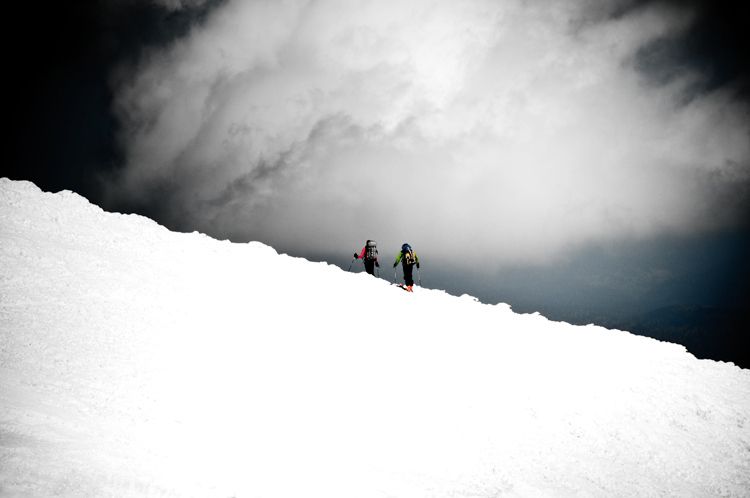 Kevin Williams and Ken Young ski off the summit of Mount Adams Washington with an ofternoon storm in the offing 1mount_adams_ski