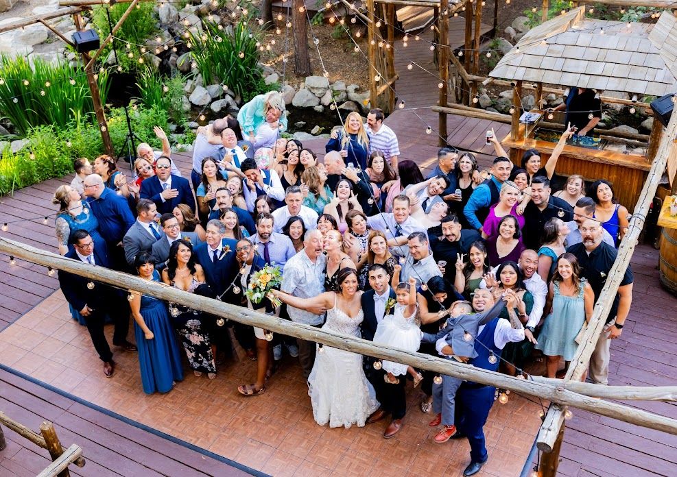 Group wedding photo on Hidden Creek Dance floor