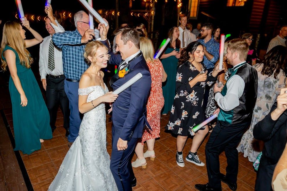 Guests dancing with light up sticks