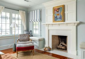 12-ansley-park-atlanta-bedroom-white-fireplace-chair.jpg