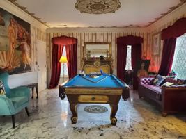 09-cipresso-castle-decatur-billiards-room-burgundy-sofa.jpg