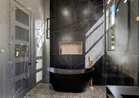 18-atlanta-modern-luxury-estate-black-marble-freestanding-bathtub.jpg