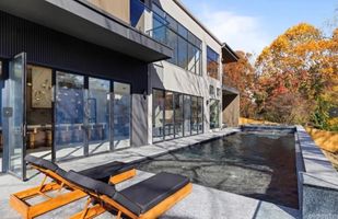 31-atlanta-modern-luxury-estate-poolside-glass-walls.jpg