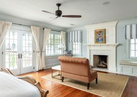 11-ansley-park-atlanta-light-blue-bedroom-sitting-fireplace.jpg