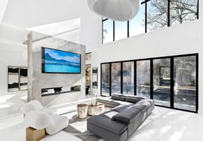 09-atlanta-modern-luxury-estate-living-room-sculptural-chairs.jpg
