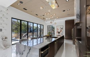 11-atlanta-modern-luxury-estate-marble-kitchen-window-wall.jpg