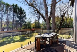 35-atlanta-modern-luxury-estate-glass-rail-balcony-dining.jpg