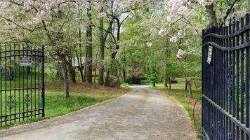 34-cipresso-castle-decatur-blossoming-gated-driveway.jpg