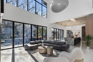 01-atlanta-modern-luxury-estate-sunlit-living-room-floor-to-ceiling-windows.jpg