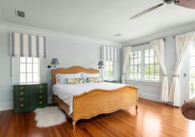 10-ansley-park-atlanta-light-blue-bedroom-wood-bed.jpg