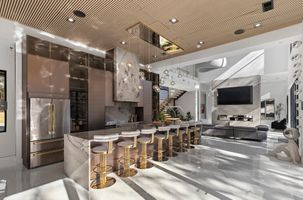 03-atlanta-modern-luxury-estate-marble-kitchen-gold-stools.jpg