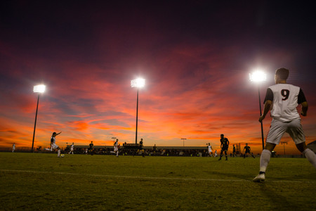The sky lights up on a fall evening during a soccer match between San Diego State and Cal Soccer Under The Lights