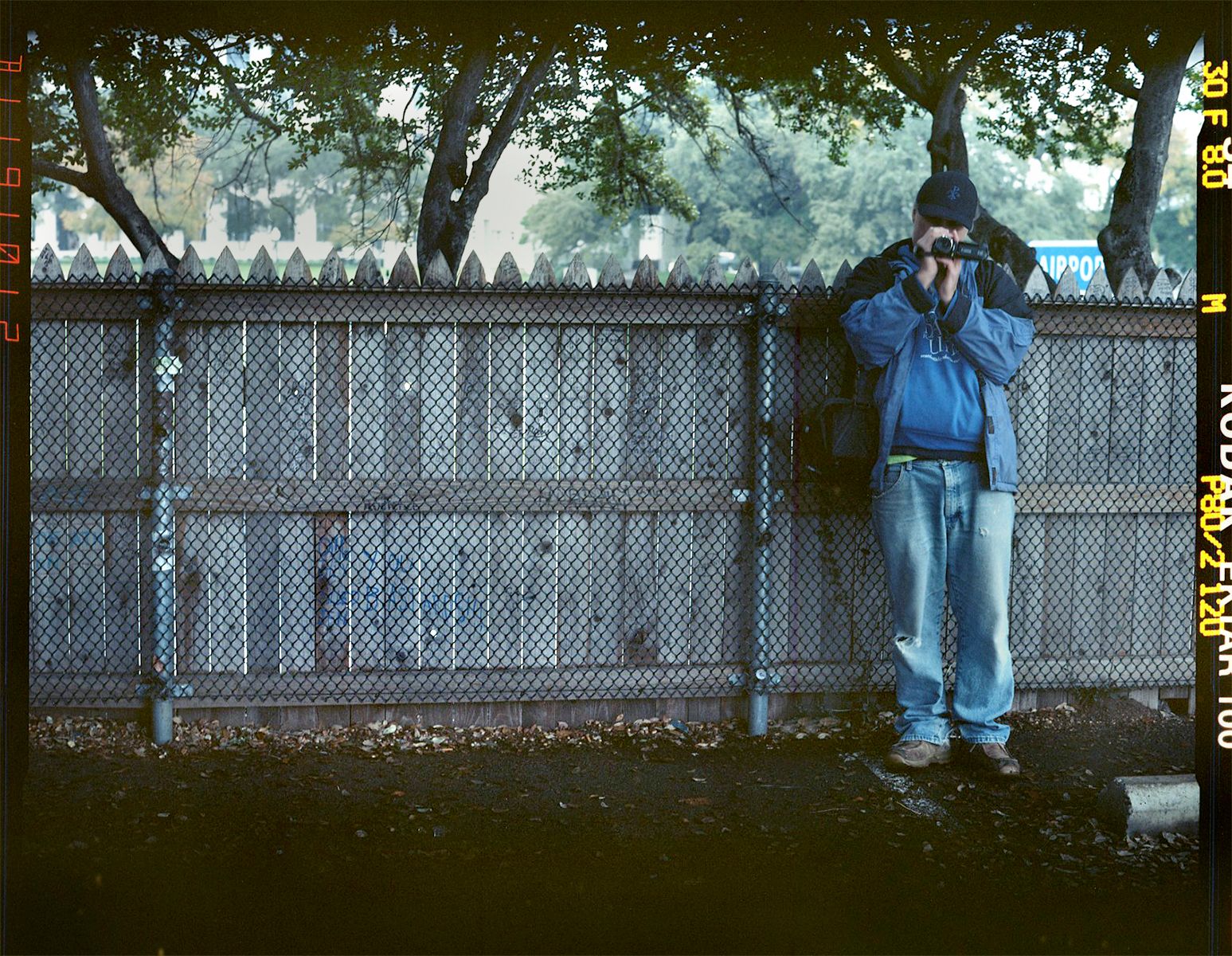 THE PICKET FENCE ON THE GRASSY KNOLL, FROM WHERE SOME EYEWITNESSES AND CONSPIRACY THEORISTS CLAIM (SOME OF) THE ASSASSINATION SHOTS WERE FIRED