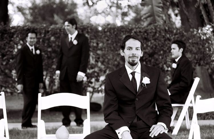 groomsmen at a wedding reception in a candid photo by Issa Sharp
