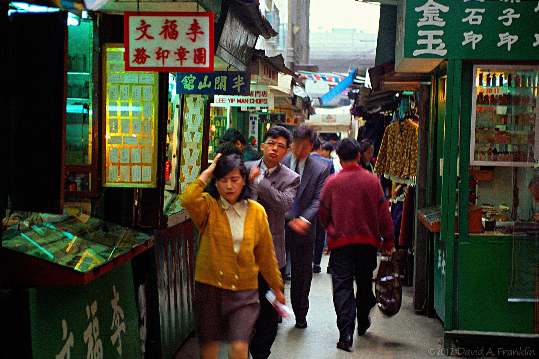 Shops-Customers-Pedestrians_LiningCrowdedAlley_HongKong_Editorial
