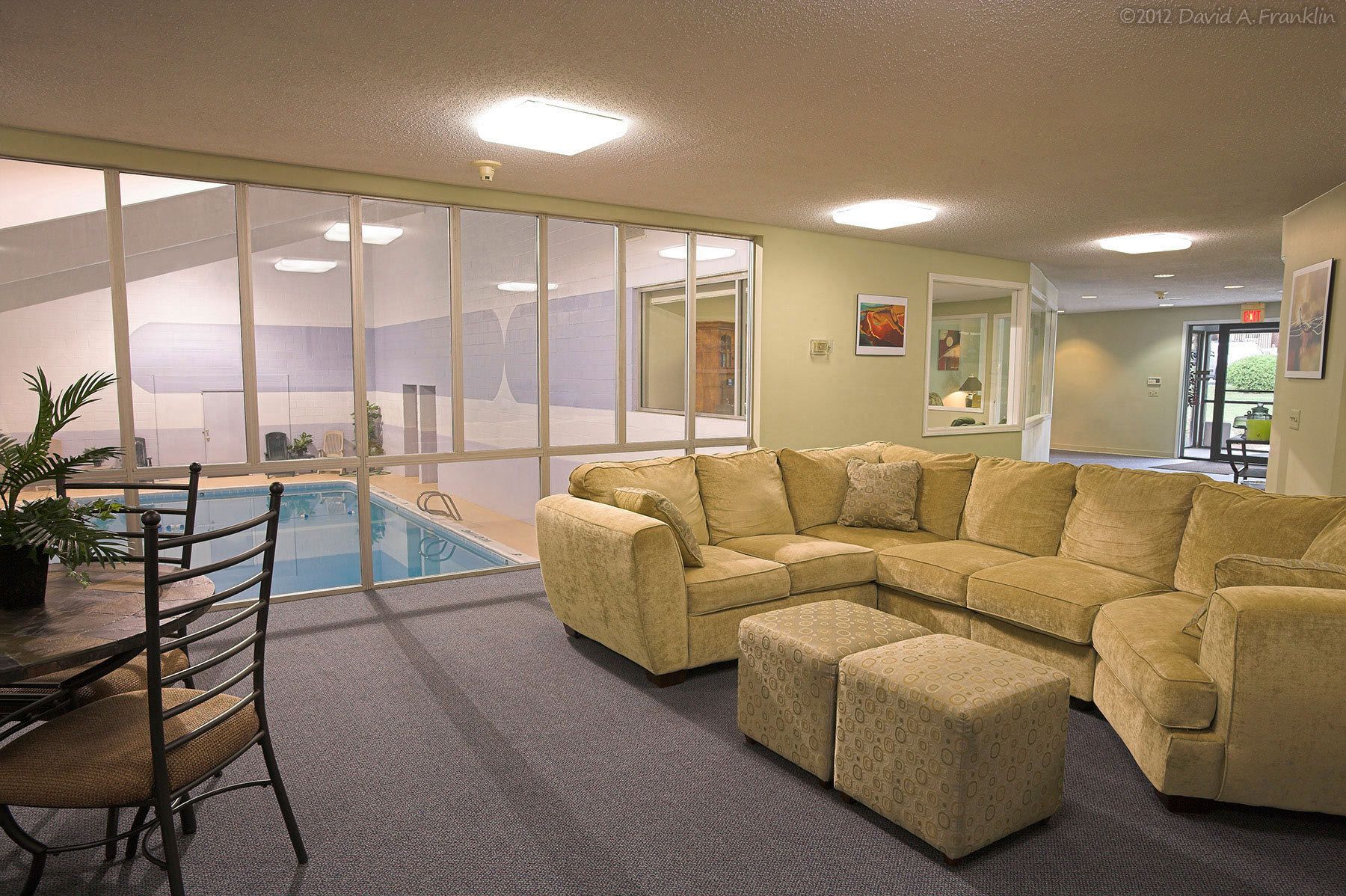ApartmentComplex_Interior_BretonCourt_ClubhouseCommonArea-ViewOfIndoorPool_LeasingBrochure