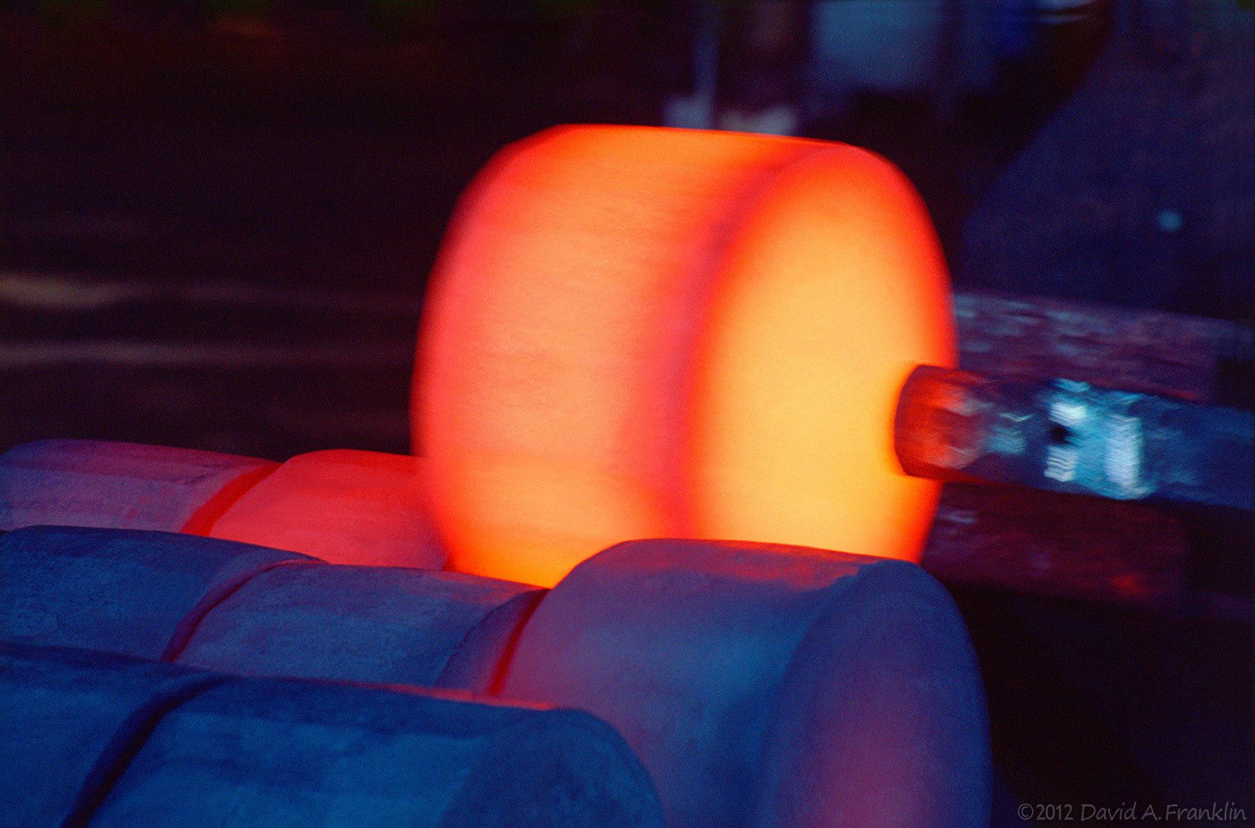 RedHotSteel_StackingRoundIngots_Foundry_AjaxSteel_Advertising