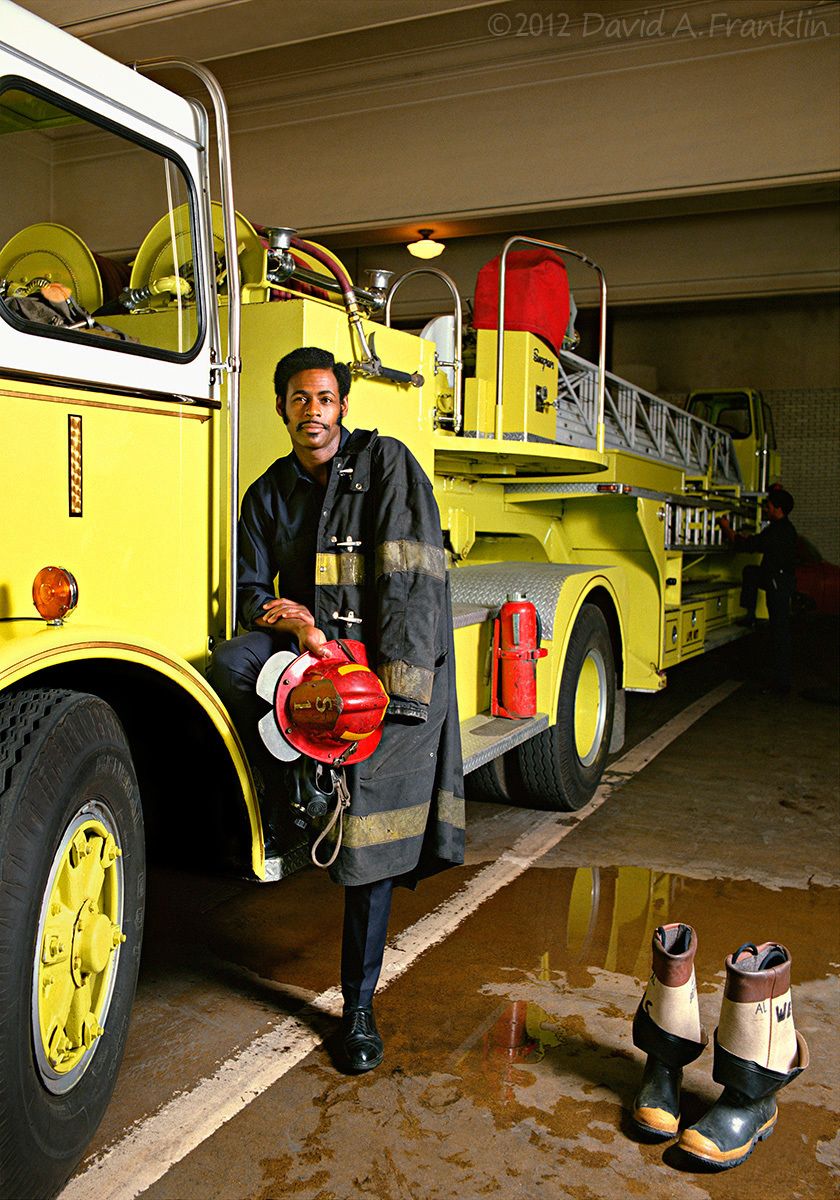 DetroitFireman_AlbertWells_JustAfterFireRun_WithTruckInStation_Editorial