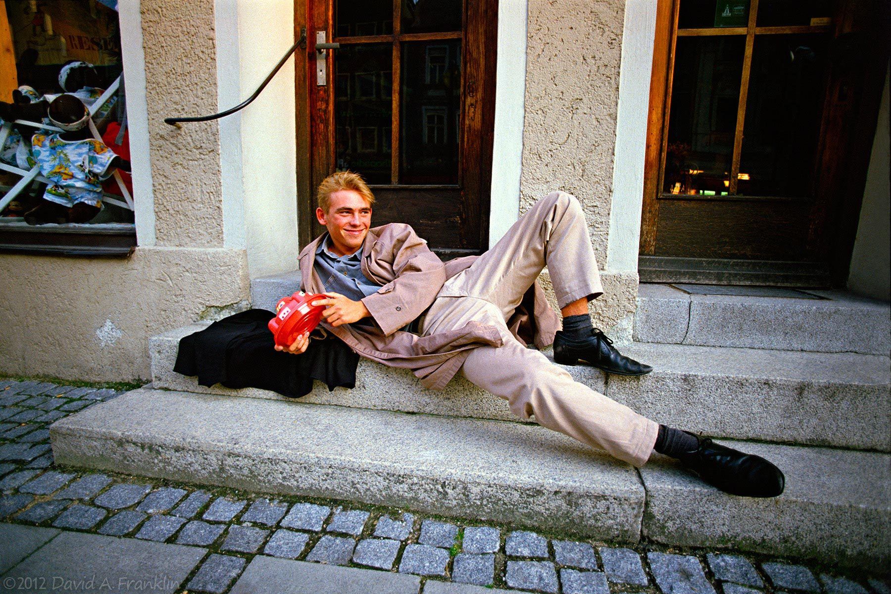 YoungWorkerOnLunchBreak_Holding McDonaldsContainer_BavariaGermany_Editorial