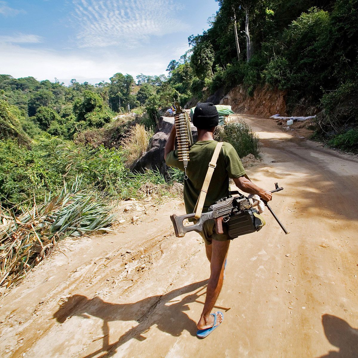 A soldier carries a machine gun in the Dongrak mountains.