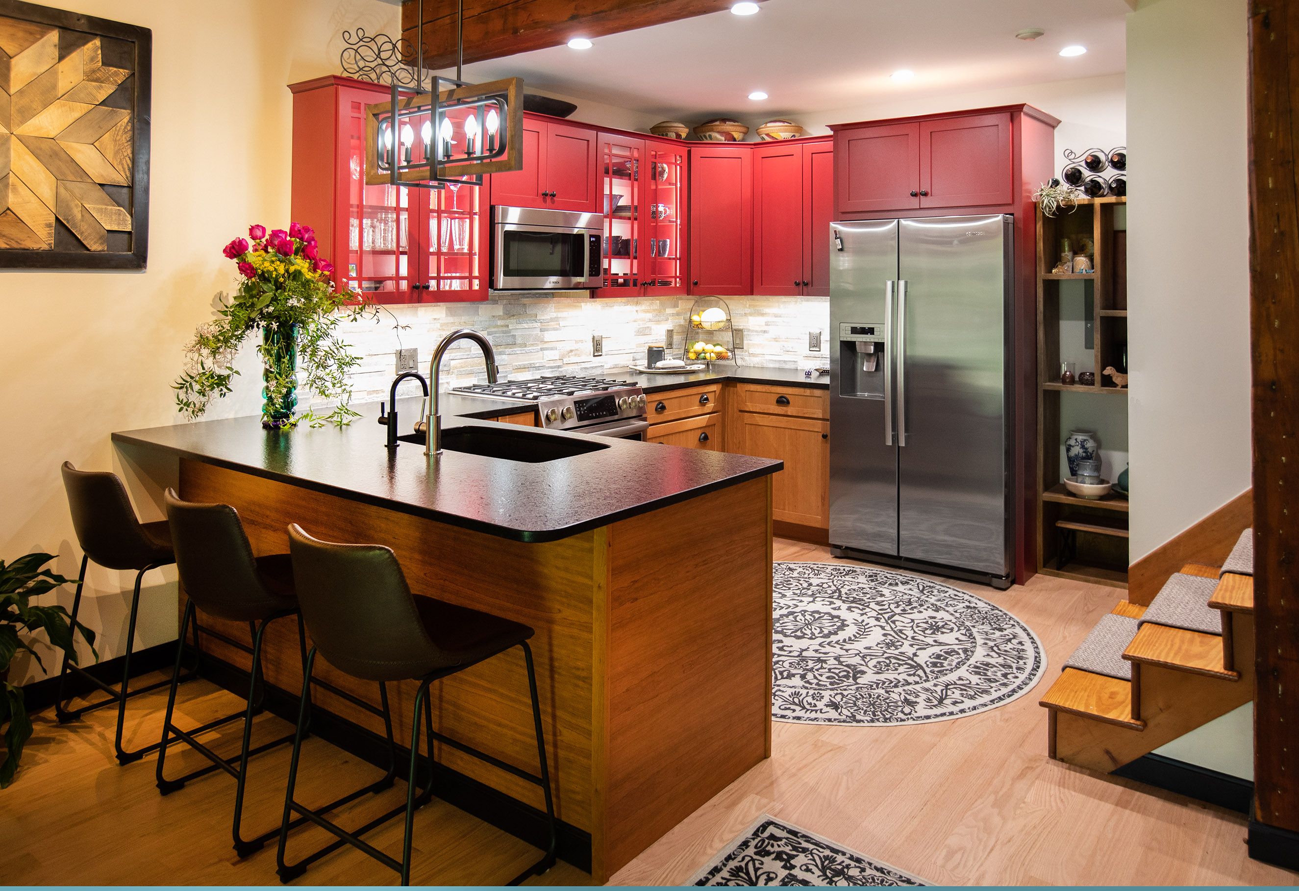 Kitchen with red cabinets and cherry bases