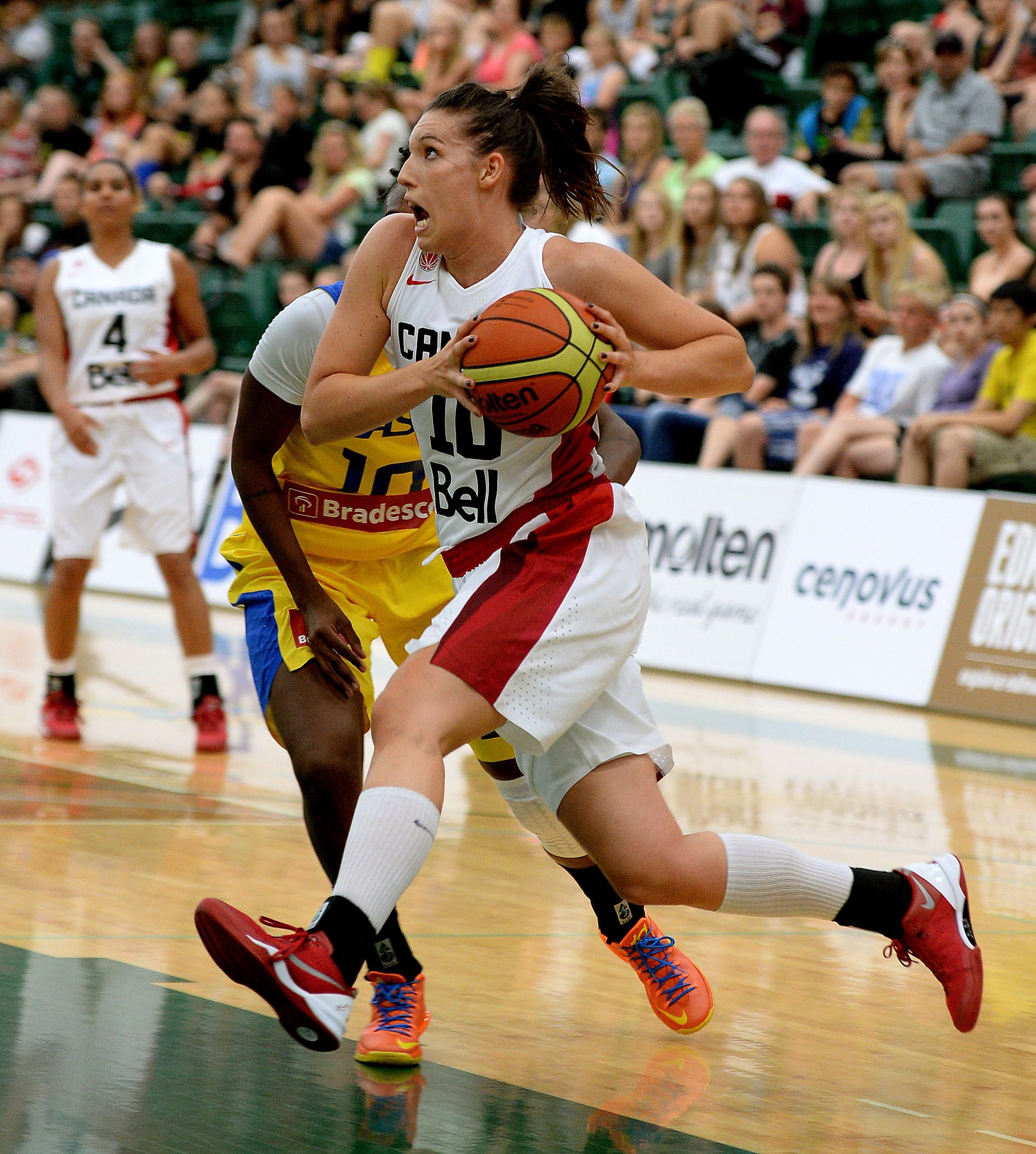 EDMONTON, ALBERTA: JUNE 26, 2014 - Canada's Kendell Ross drives to the net during game action against Brazil in the first game of the inaugural Edmonton Grads International Classic, a three-game series between Canadaâ€™s National Womenâ€™s Basketball Team, ninth ranked team in the world, and Brazilâ€™s National Women's Basketball Team, seventh-ranked team in the world. The three-game series is being played at the Saville Community Sports Centre on June 26, 27 and 28, 2014. The event will be the first time Edmontonians will see the national team in competition since they relocated to Edmonton last spring. (PHOTO BY LARRY WONG/EDMONTON JOURNAL)