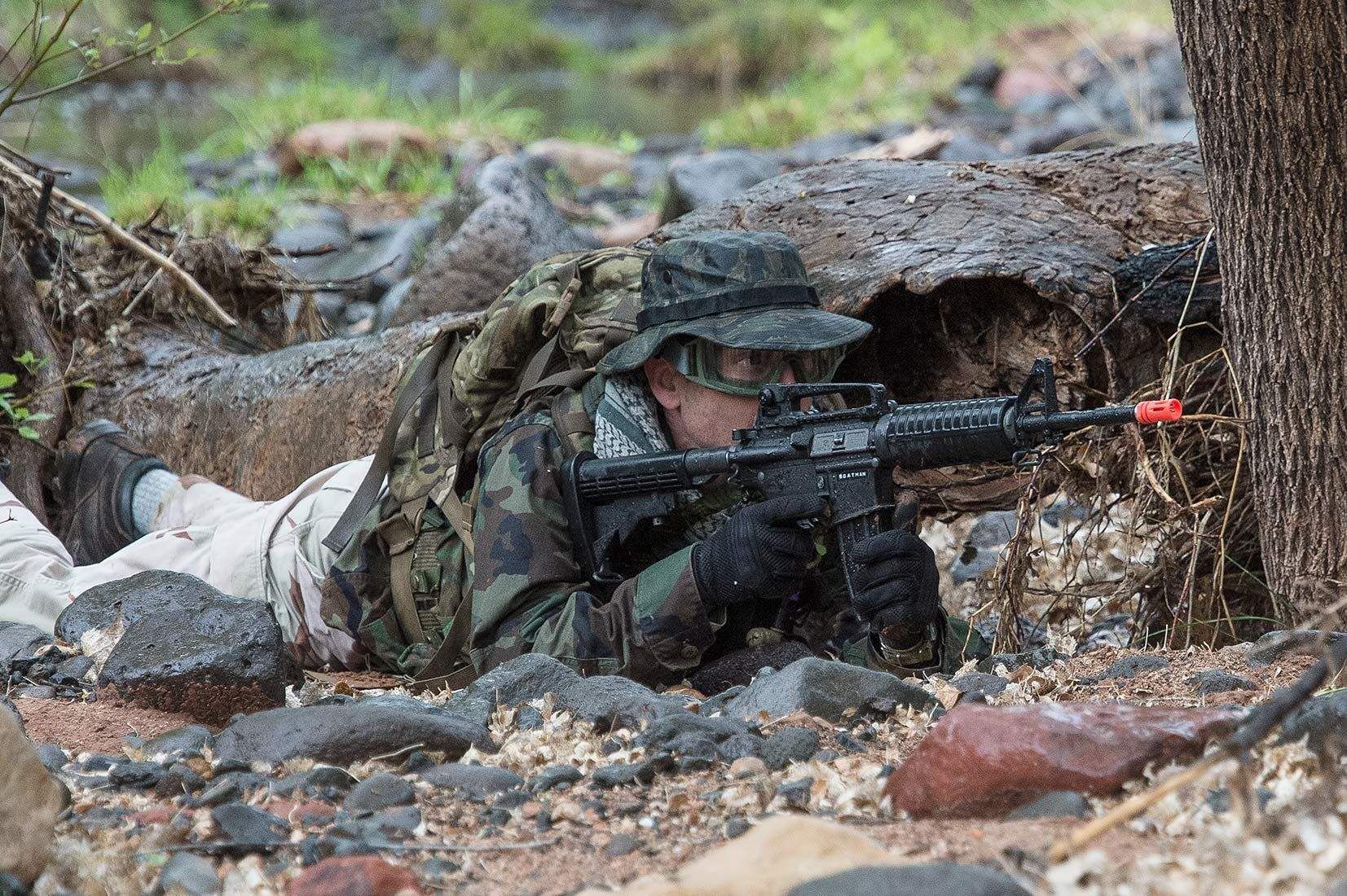 13_0_2358_101801_airsoft_combatant_firing_from_prone_position_behind_tree_wet_beaver_creek_20140426_dsc2529_new.jpg