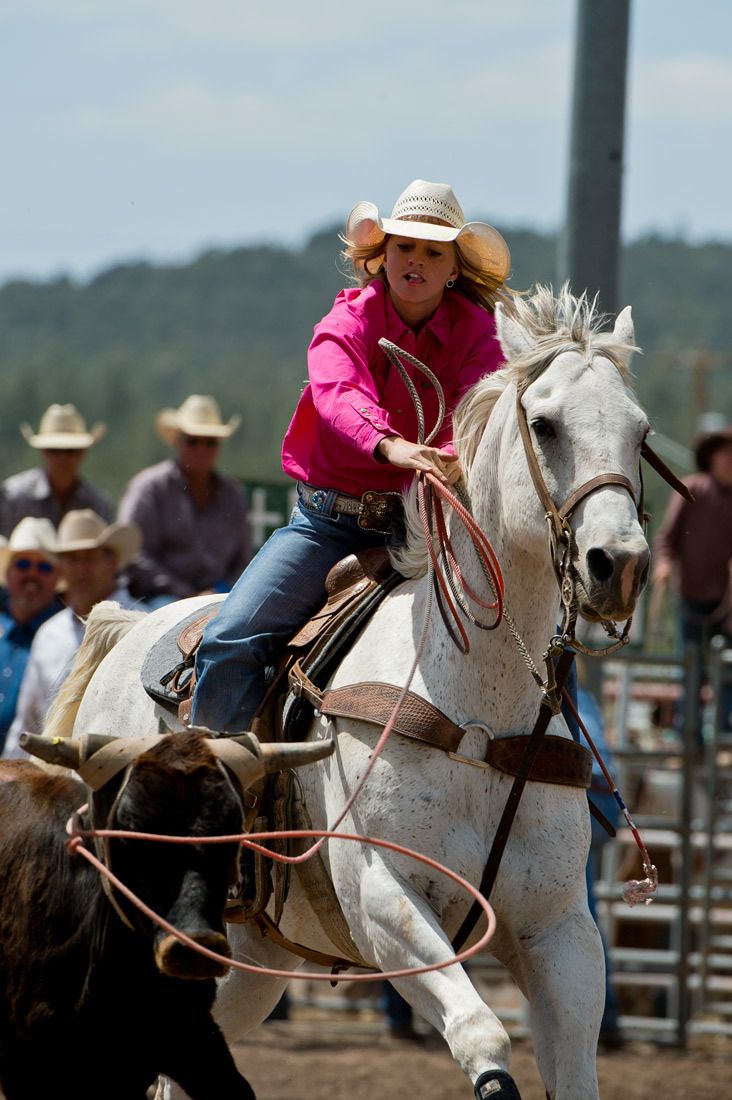 01597 Young Cowgirl Team Roper Throwing Rope
