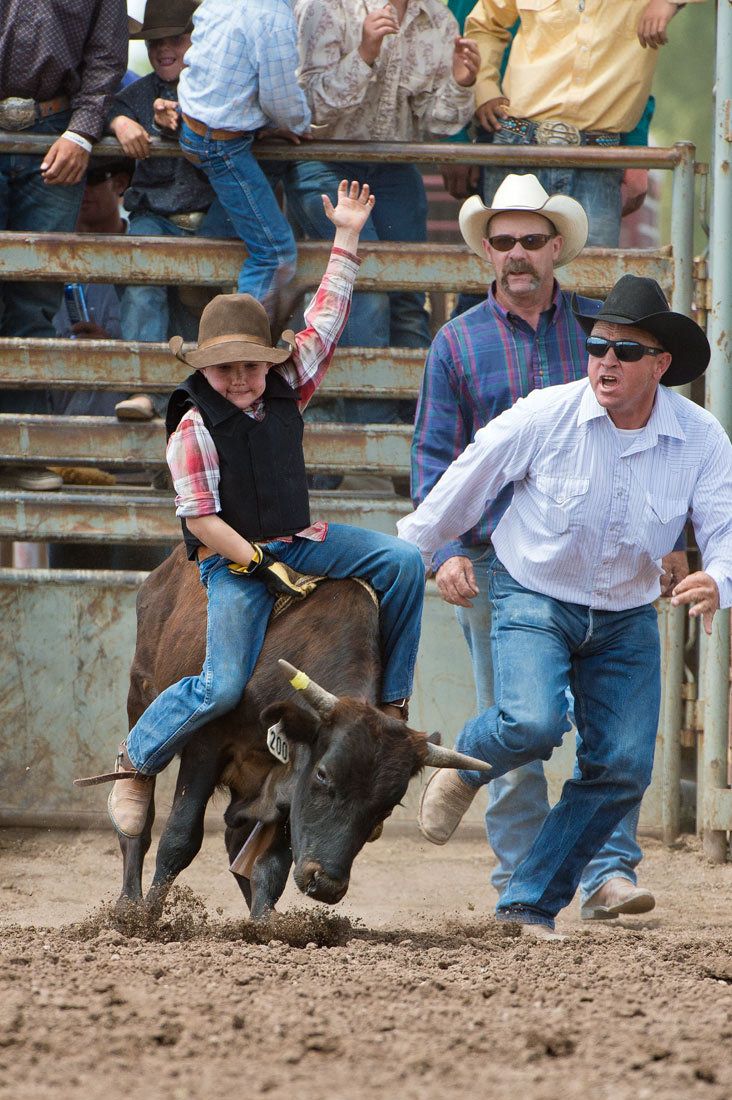 01605 Young Cowboy Steer Rider with Arm Outstretched and Pursuing Cowboy