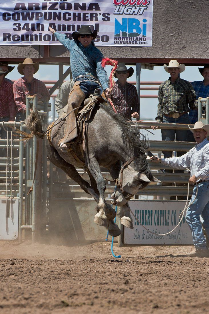 01575 Bronc Rider with Outstretched Arm on Airborne Horse