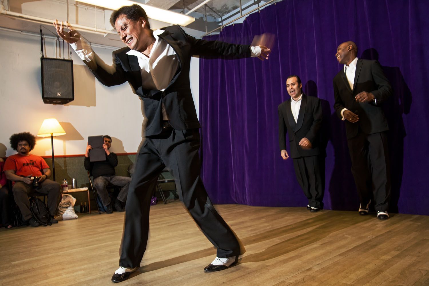 Jimmy Anton, Carlos Konig and Delille Thomas perform a mambo routine
