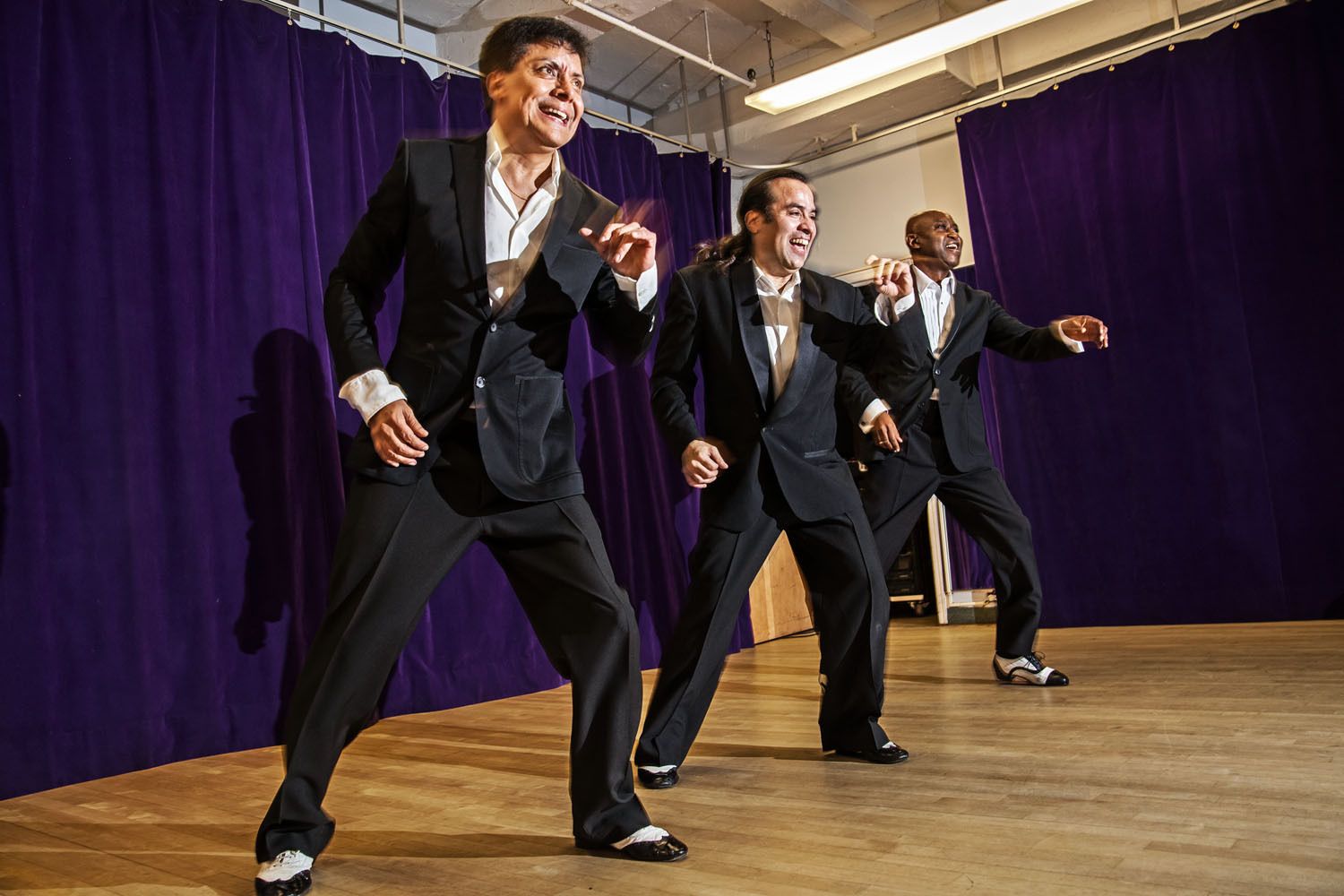 Jimmy Anton, Carlos Konig and Delille Thomas perform a mambo routine