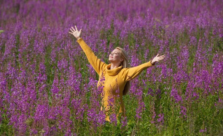 1Woman_welcoming_the_day_in_a_field_of_flowers.jpg